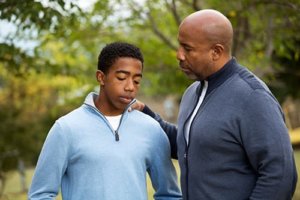 father and son discussing the adolescent treatment admissions process