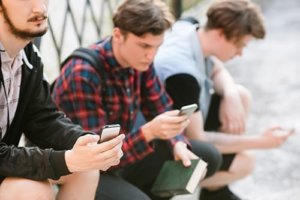 group of teens in need of a social media addiction treatment center